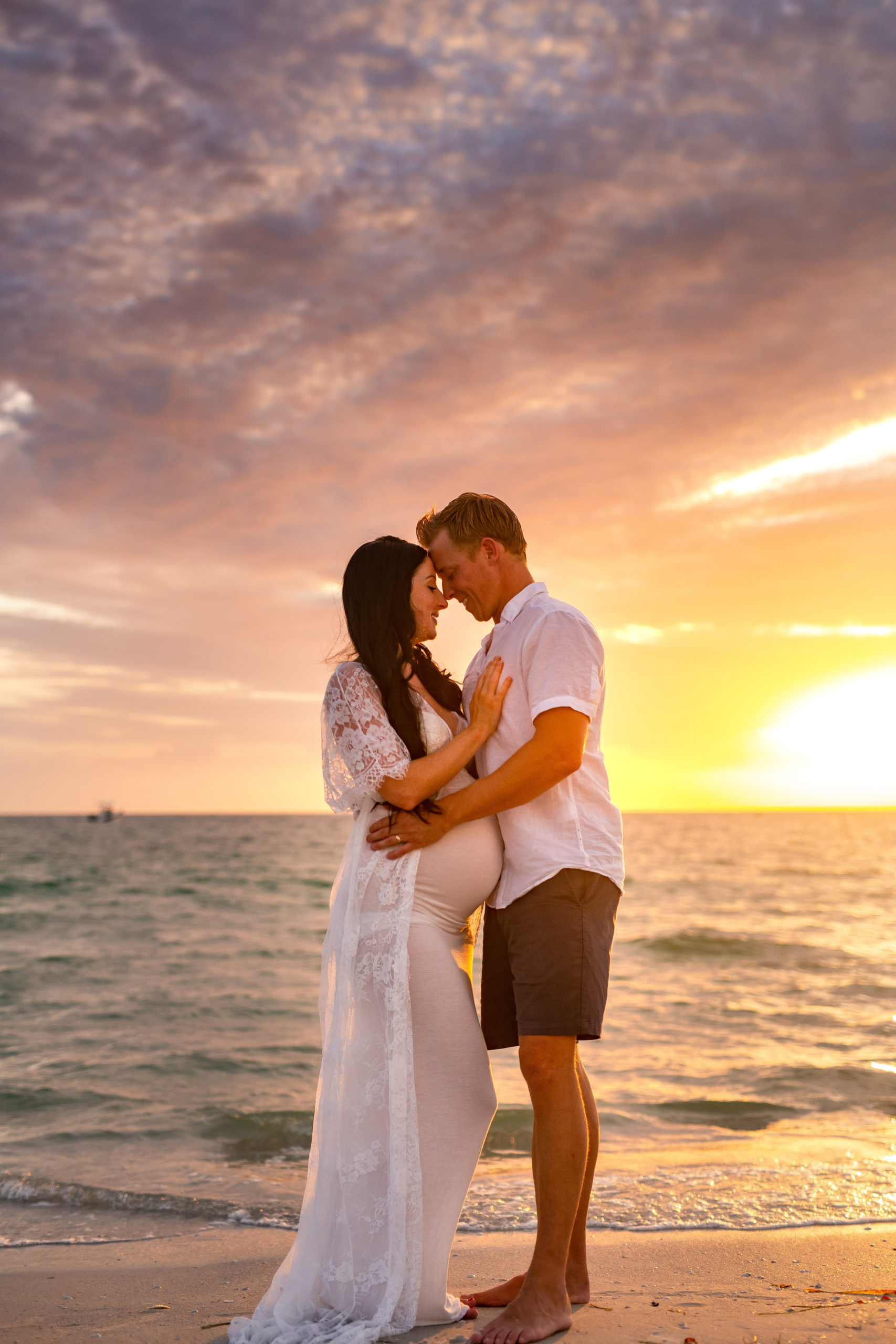 couples maternity pictures on the beach, st Pete fl 