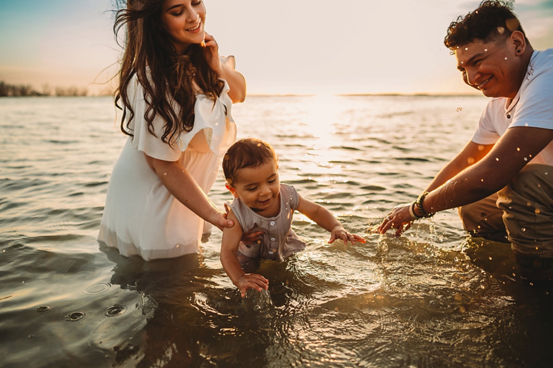fun beach family portraits in water, tampa family photographer 