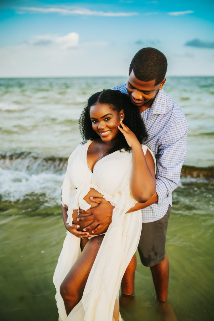 beach couples maternity photo shoot in the water, Pinellas County FL