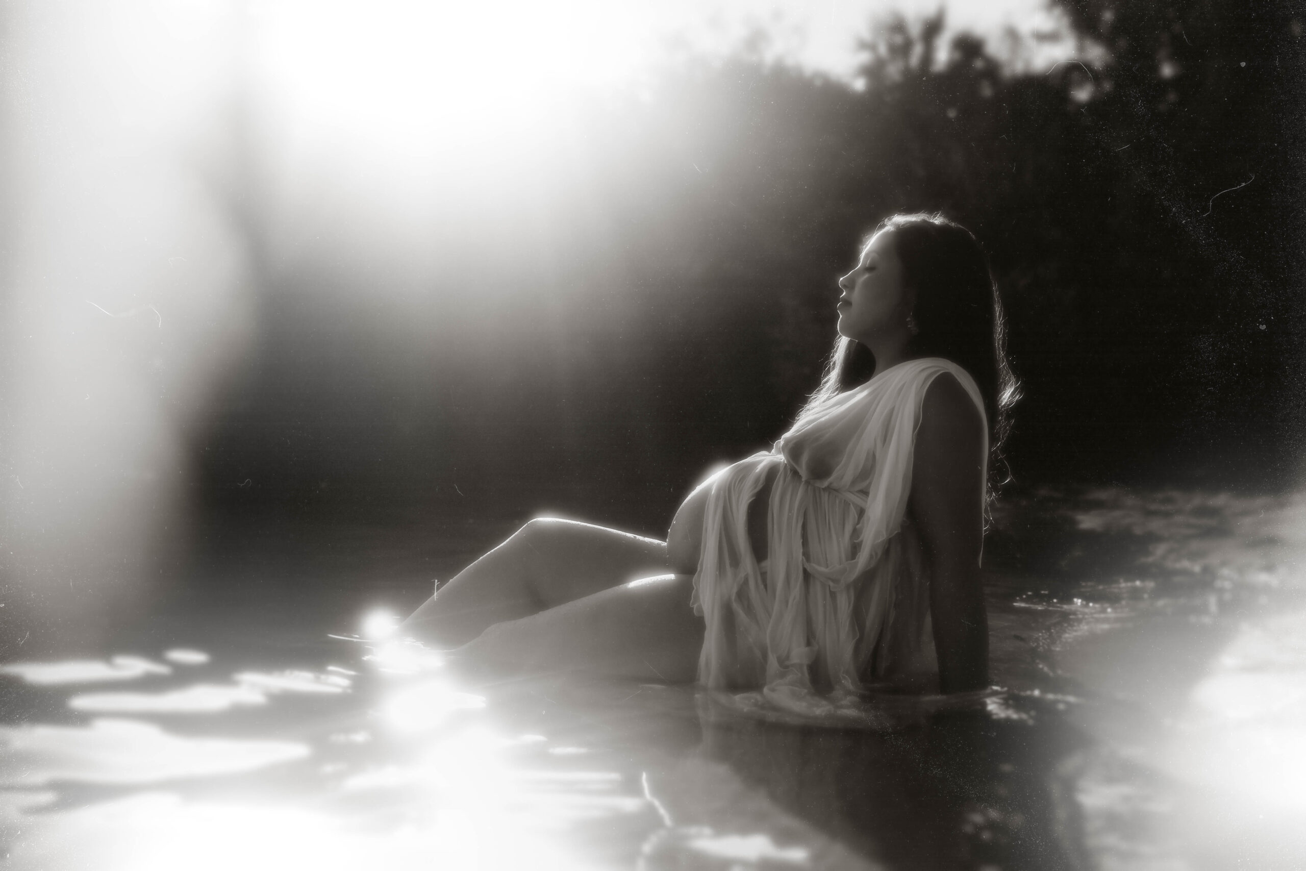 ethereal goddess fine art maternity photos in the water