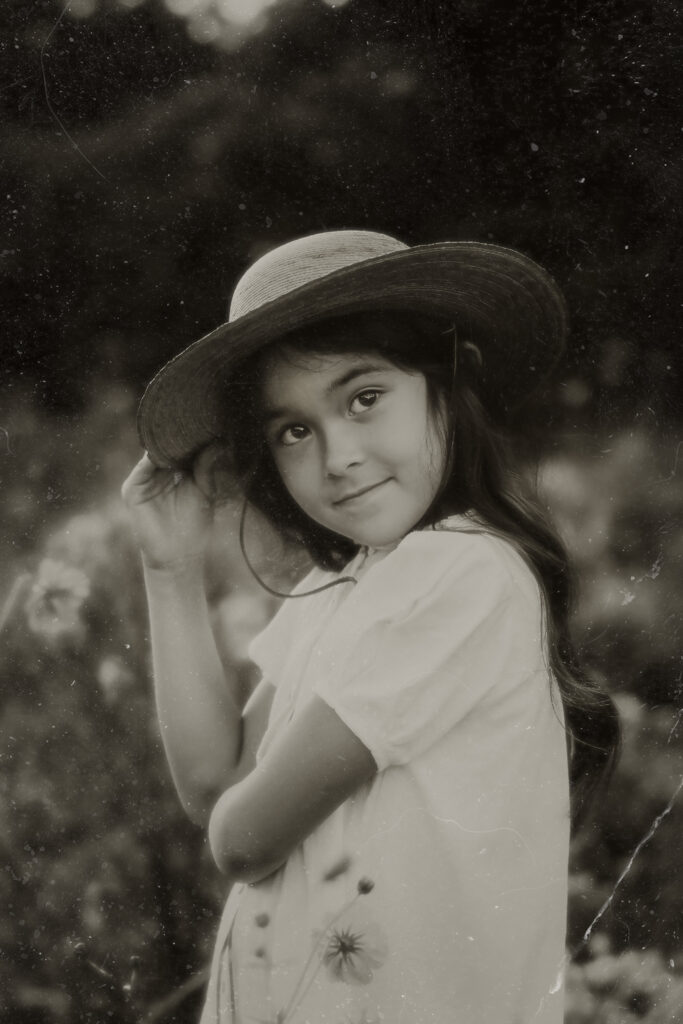 vintage tintype style photo of a young girl during a photo session